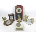 A group of seven modern mantel clocks, together with a set of Ohaus scales, and a Scientec Inc diamo... 