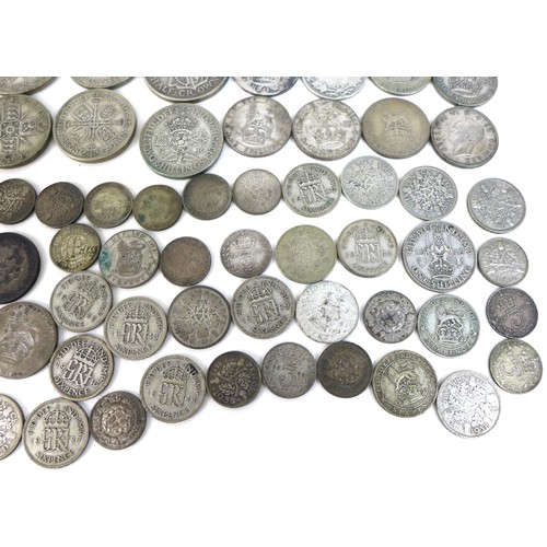 75 - A large collection of British coins, comprising coins with silver content thirteen post 1920 and pre... 