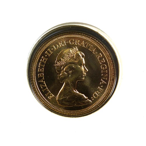 81 - An Elizabeth II gold sovereign, 1982, mounted upon a commemorative Princess Diana 21st Birthday Firs... 