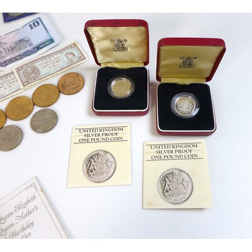 74 - A collection of British coinage, including two sterling silver proof 1983 £1 coins, three proof sets... 