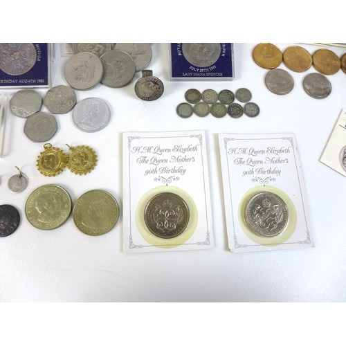 74 - A collection of British coinage, including two sterling silver proof 1983 £1 coins, three proof sets... 