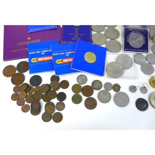 74 - A collection of British coinage, including two sterling silver proof 1983 £1 coins, three proof sets... 