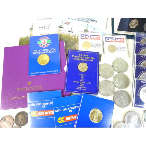 74 - A collection of British coinage, including two sterling silver proof 1983 £1 coins, three proof sets... 