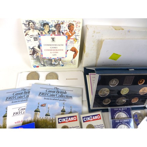 74 - A collection of British coinage, including two sterling silver proof 1983 £1 coins, three proof sets... 