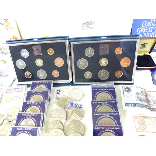 74 - A collection of British coinage, including two sterling silver proof 1983 £1 coins, three proof sets... 