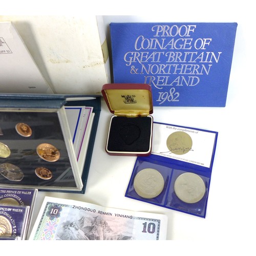 74 - A collection of British coinage, including two sterling silver proof 1983 £1 coins, three proof sets... 