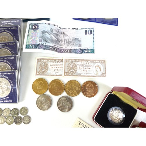 74 - A collection of British coinage, including two sterling silver proof 1983 £1 coins, three proof sets... 