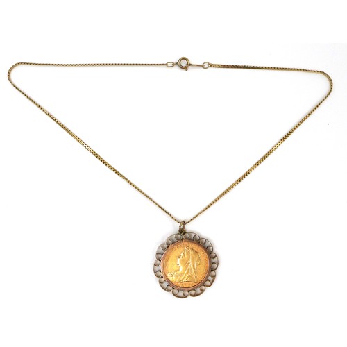 85 - A Victoria Old Head gold sovereign, 1897, in a 9ct gold scroll pendant mount with 9ct gold chain, 13... 