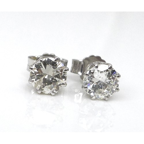 256 - A pair of diamond and 18ct white gold stud earrings, each of approximately 0.5ct, 1.8g.