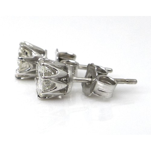 256 - A pair of diamond and 18ct white gold stud earrings, each of approximately 0.5ct, 1.8g.