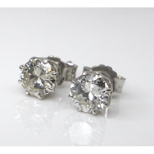 256 - A pair of diamond and 18ct white gold stud earrings, each of approximately 0.5ct, 1.8g.