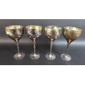 Two pairs of Culinary Concepts silver plated wine goblets, with planished effect decoration, each 20... 