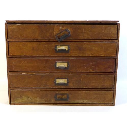 90 - A collection of watch parts, contained within an oak five drawer table top chest, comprising a large... 