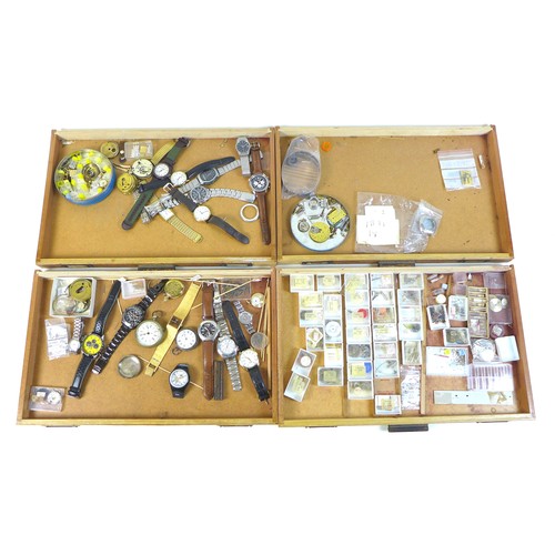 92 - A collection of watch parts, contained within an oak ten drawer table top chest, labelled 'A Beechpa... 