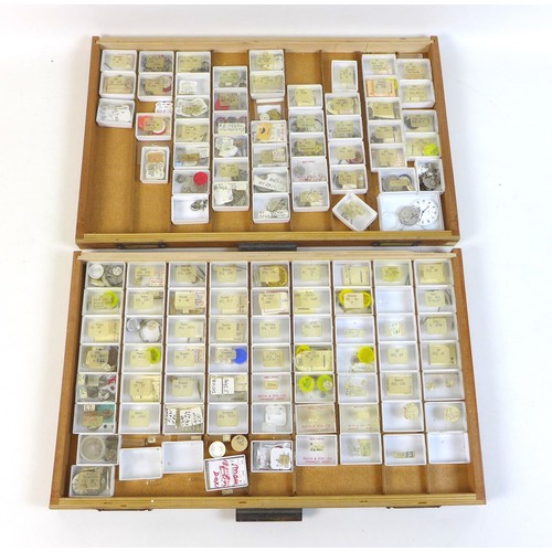 92 - A collection of watch parts, contained within an oak ten drawer table top chest, labelled 'A Beechpa... 