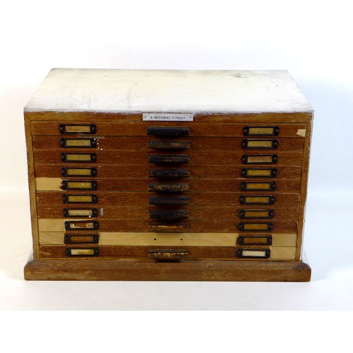 92 - A collection of watch parts, contained within an oak ten drawer table top chest, labelled 'A Beechpa... 