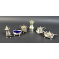 A group of silver table wares, comprising a mustard, salt and pepperette, complete with mustard spoo... 