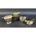 A late Art Deco silver sugar bowl and jug of curviliniar design typical of the period, Birmingham 19... 