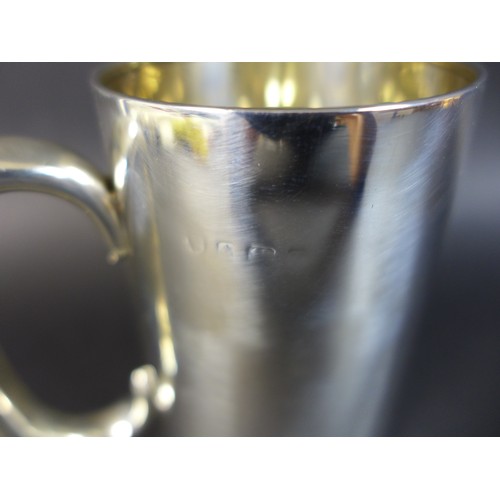 45 - A early 20th century British silver tankard, with rubbed hallmarks but possibly Birmingham, 12 by 9 ... 