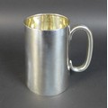 A early 20th century British silver tankard, with rubbed hallmarks but possibly Birmingham, 12 by 9 ... 