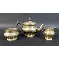 A George V silver bachelor's tea set, of compressed bun form on circular foot, comprising a teapot w... 