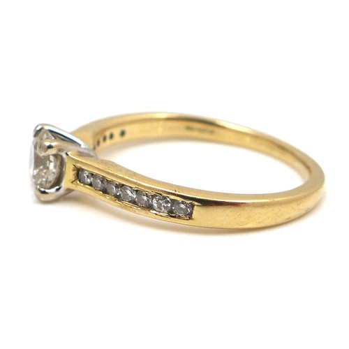 257 - An 18ct yellow gold and diamond solitaire ring, the 0.5ct brilliant cut stone flanked on each should... 