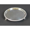 A George III silver waiter tray, with reeded rim, engraved armorial mark of a man's head and shoulde... 