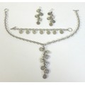 A set of designer silver jewellery, comprising a pair of earrings, bracelet and necklace, of exagera... 