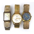 A group of three gold plated gentleman's wristwatches, comprising a MuDu Doublematic, with circular ... 