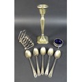 A group of silver items, comprising a single George V candlestick with octagonal base 7.2 by 7.2 by ... 