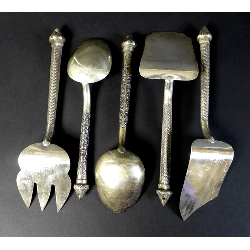 65 - A large collection of Cambodian Khmer silver serving utensils, comprising three graduated ladles, fo... 