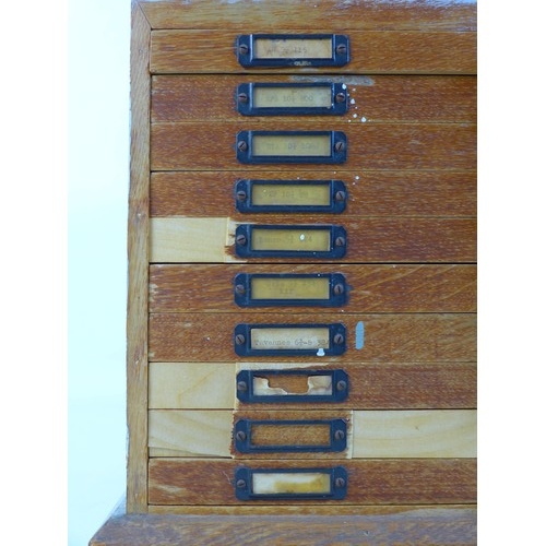 92 - A collection of watch parts, contained within an oak ten drawer table top chest, labelled 'A Beechpa... 