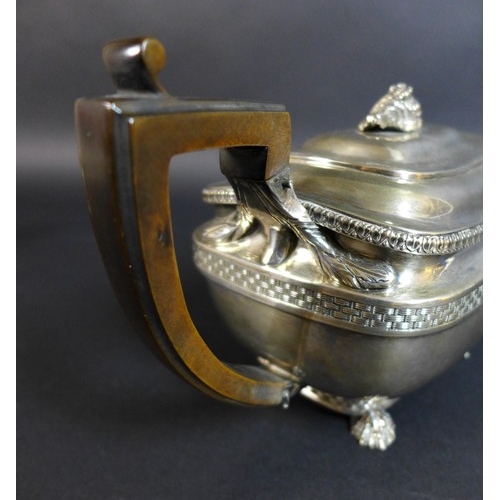 61 - A George III silver teapot and matching milk jug, of London shape with basket weave and stiff leaf b... 