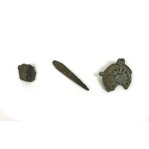 74 - A group of three interesting and decorative Bronze Age, Roman and Early Medieval detectorist finds, ... 