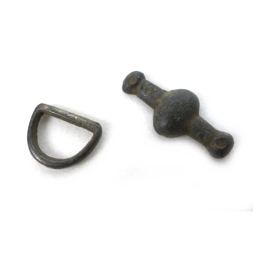 79 - A group of six Medieval and later detectorist finds, comprising a strap fitting, of subovate central... 