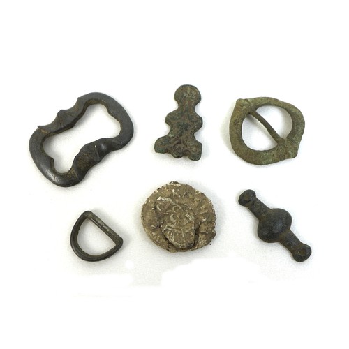 79 - A group of six Medieval and later detectorist finds, comprising a strap fitting, of subovate central... 