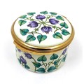 A modern Moorcroft enamel box clock, decorated with Florida Star pattern, of cylindrical form with h... 