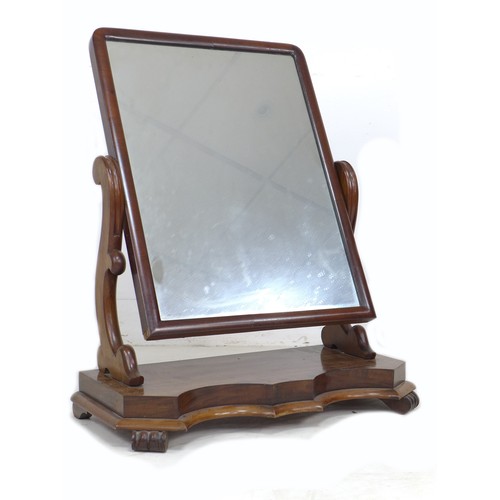 341 - A Victorian mahogany toilet mirror, rectangular plate, shaped supports, serpentine fronted base with... 