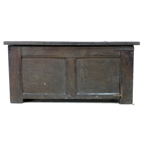 343 - An early 18th century oak blanket chest, with two panelled front and top, loop hinges, stile feet, 1... 