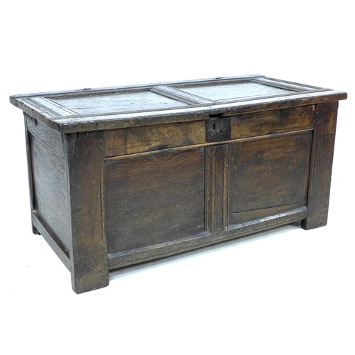 343 - An early 18th century oak blanket chest, with two panelled front and top, loop hinges, stile feet, 1... 