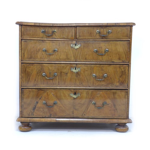 359 - A Queen Anne period, early 18th century, walnut veneered chest of two short over three long drawers,... 