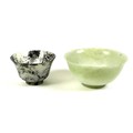 Two Chinese carved jade bowls, both mid to late 20th century, one of pale green colour, 12 by 6cm, t... 