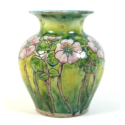 59 - An Arts & Crafts Della Robbia (1897-1906) pottery vase, circa 1900, of baluster form with flared rim... 