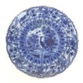 A Dutch blue and white tin glazed charger, with wax stamp to its base, 35 by 6cm high.
