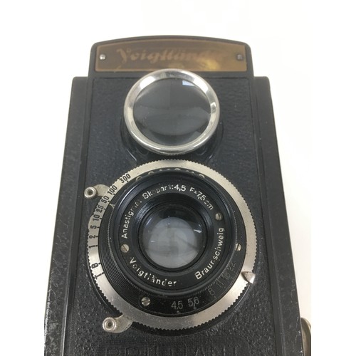 86 - A collection of Rolleiflex and Voigtlander cameras, comprising a Rolleiflex DPM DPGM Synchro Compur ... 