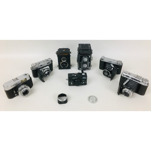 86 - A collection of Rolleiflex and Voigtlander cameras, comprising a Rolleiflex DPM DPGM Synchro Compur ... 