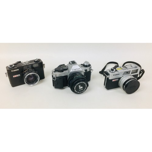 89 - Three Canon cameras, comprising a Canon AE-1 with a Canon FD 50mm 1:1,8 lens, and two Canon Canonet ... 