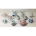 A group of eleven English 19th century and later teapots and water jugs, including a Chinese style b... 