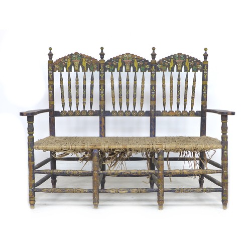 356 - A Spanish painted rush seated three seater settee, early 20th century, with shaped open arms and lad... 