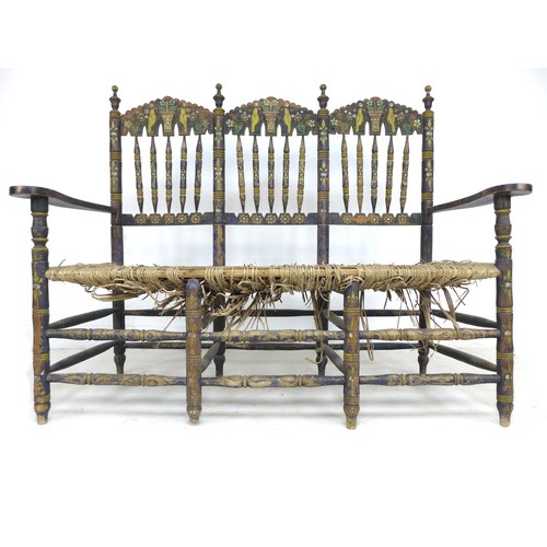 356 - A Spanish painted rush seated three seater settee, early 20th century, with shaped open arms and lad... 